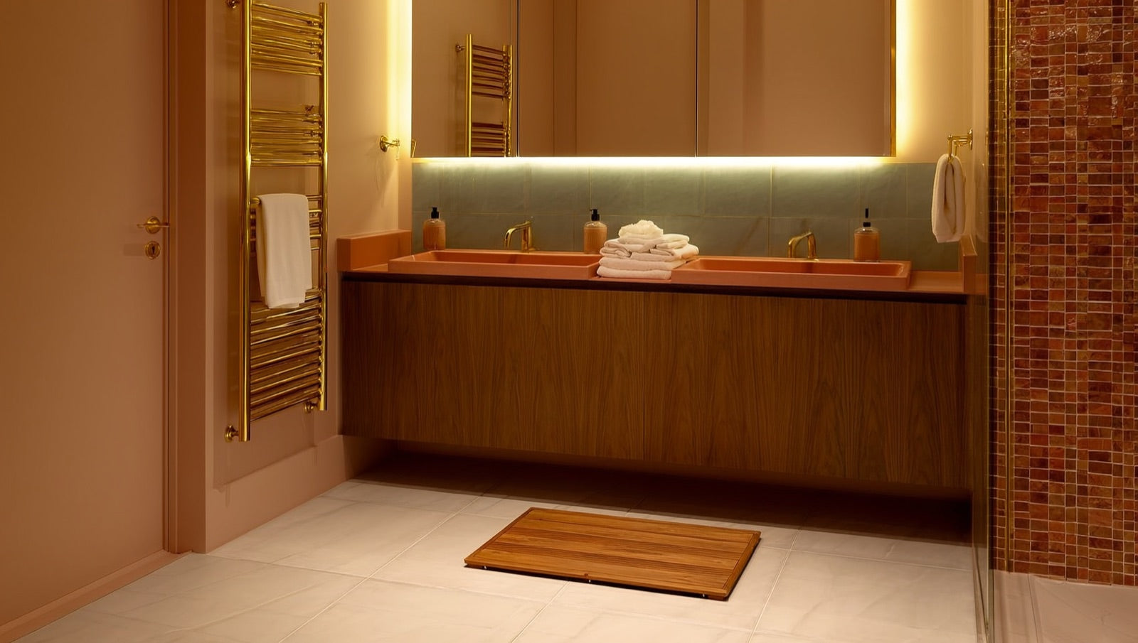 Spa-style 2026 bathroom with warm wood tones, layered lighting, heated tile floor and LED mirror