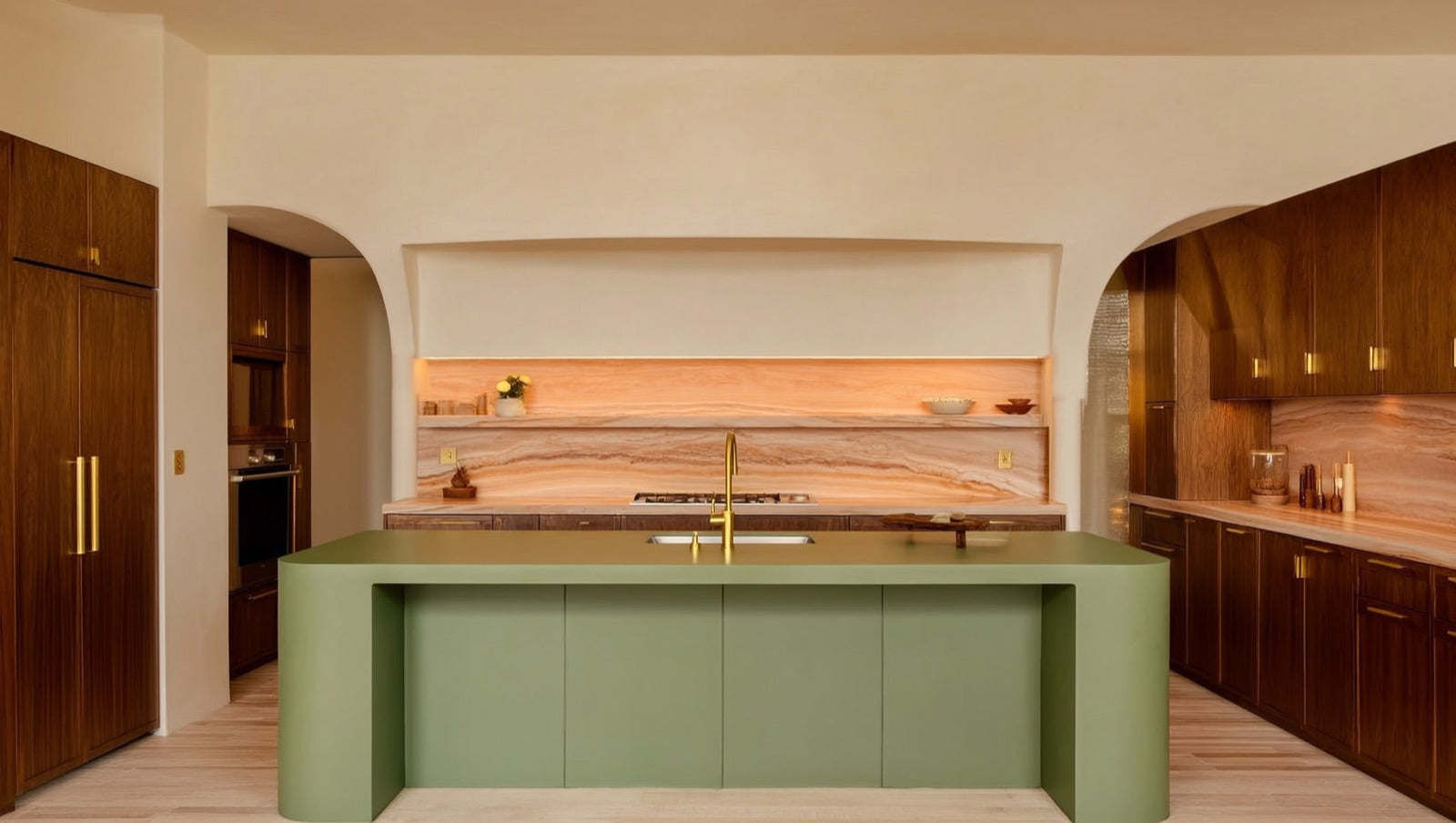 2026 kitchen design with warm wood cabinets, green island and seamless slab-and-tile surfaces