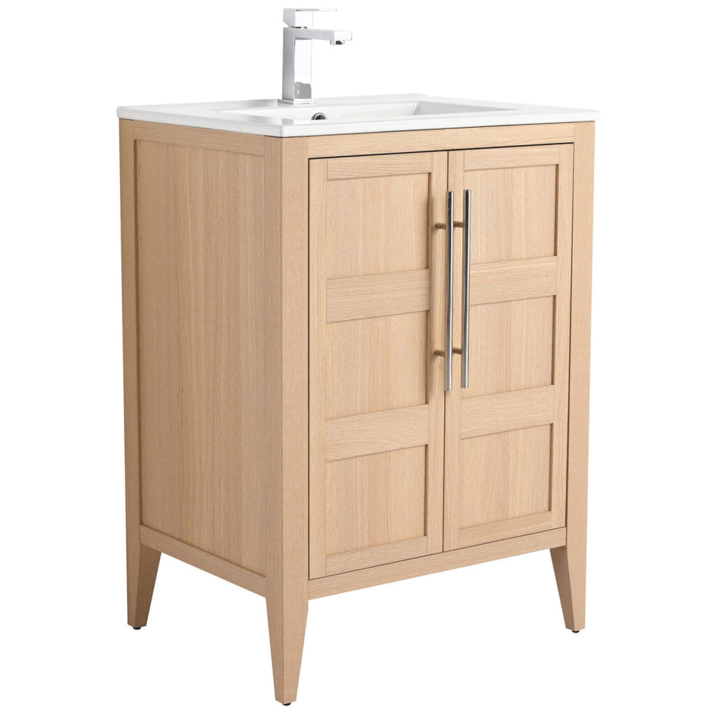 The Leafside 24 Inch Bathroom Vanity With Sink features a light wood finish, shaker-style doors, metal handles, and a white sink with a modern faucet. It elegantly stands on four tapered legs, blending style and functionality.
