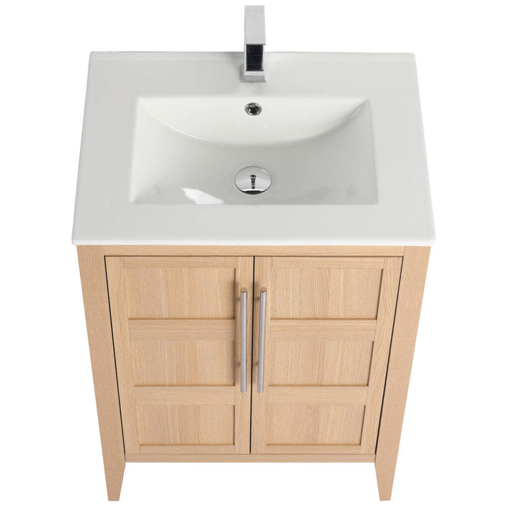 Overhead view of the Leafside 24 Inch Bathroom Vanity With Sink, featuring a white ceramic sink with a chrome faucet. The wooden cabinet has two paneled doors with sleek metal handles, and the sink includes a centered drain.