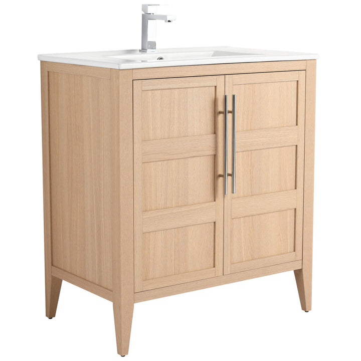 The Leafside 30 Inch Vanity flaunts a light wood finish, paneled doors, and metal handles. It includes a white countertop and modern faucet, ideal for elevating any bathroom style.