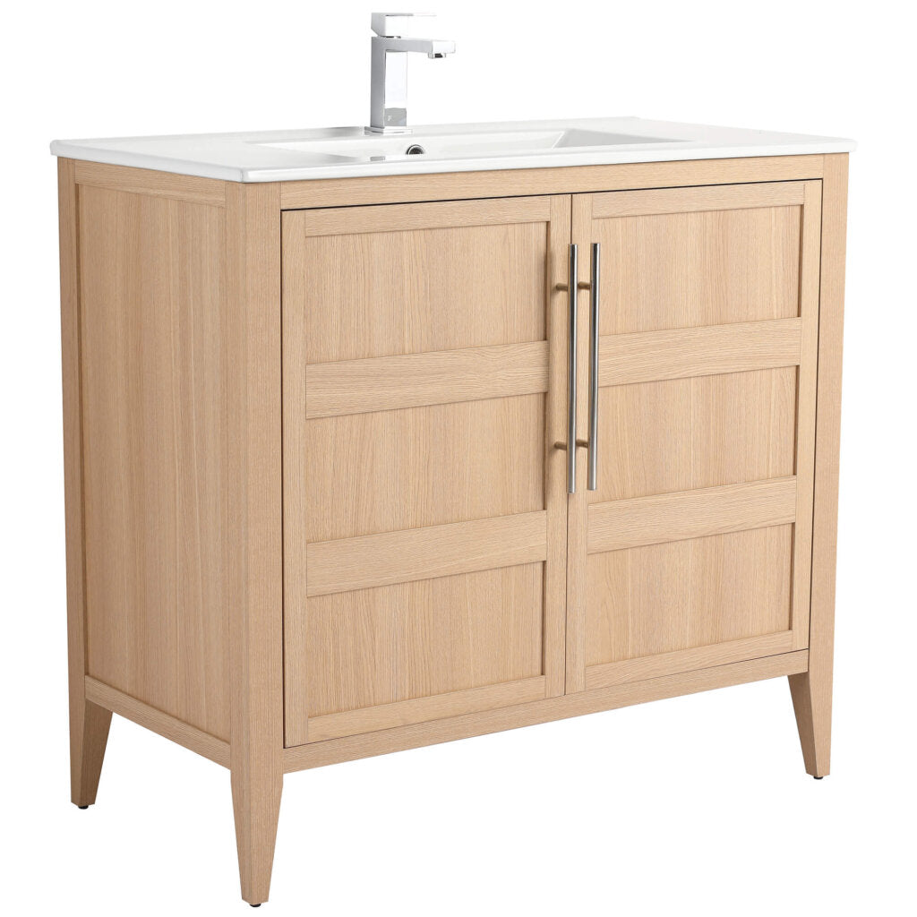 The Leafside 36 Inch Bathroom Vanity With Sink features a light oak finish, paneled doors with sleek metal handles, and a white rectangular sink paired with a modern chrome faucet, seamlessly blending functionality and style.