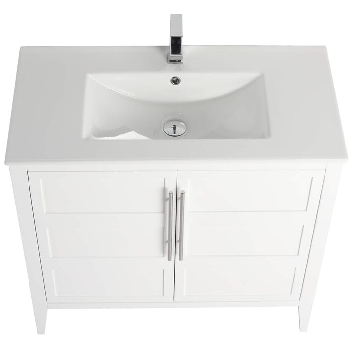 A top view of the Leafside 36 Inch Bathroom Vanity With Sink reveals its sleek rectangular sink and modern faucet. This vanity, featuring two cabinet doors with metallic handles, stands on four legs and showcases a minimalist design.