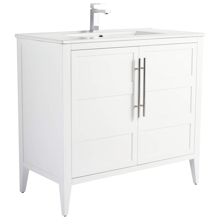 The Leafside 36 Inch Bathroom Vanity With Sink features a minimalist design, boasting a white finish and rectangular sink. It includes a single-lever faucet, two cabinet doors with vertical metal handles, and is supported by four tapered legs.