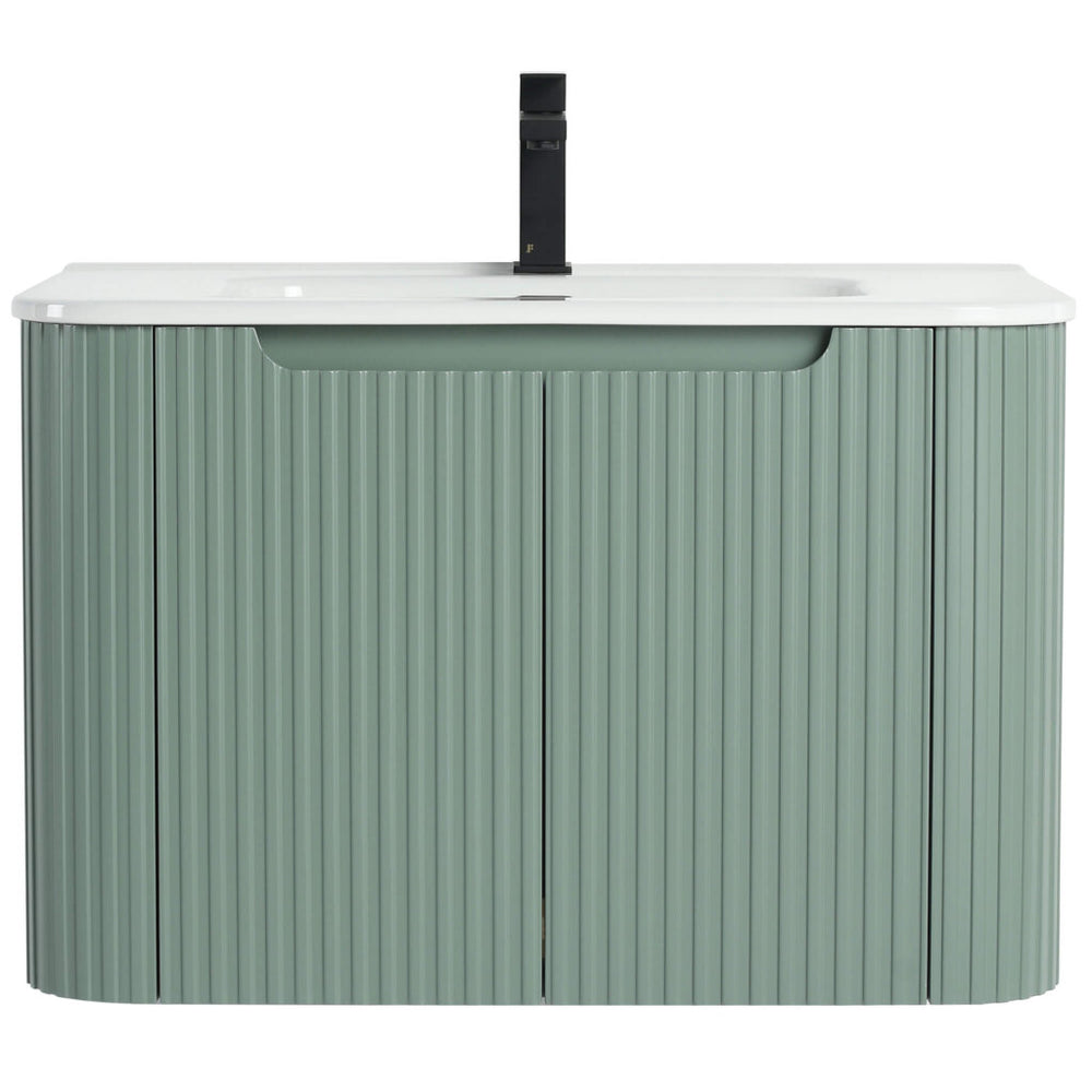 The Caskvalley 30 Inch Wall Mounted Bathroom Vanity With Sink offers a modern design featuring a sleek white countertop and integrated sink. Its base has a vertical ribbed pattern in muted green, harmonized by a centered black faucet for an elegant touch.