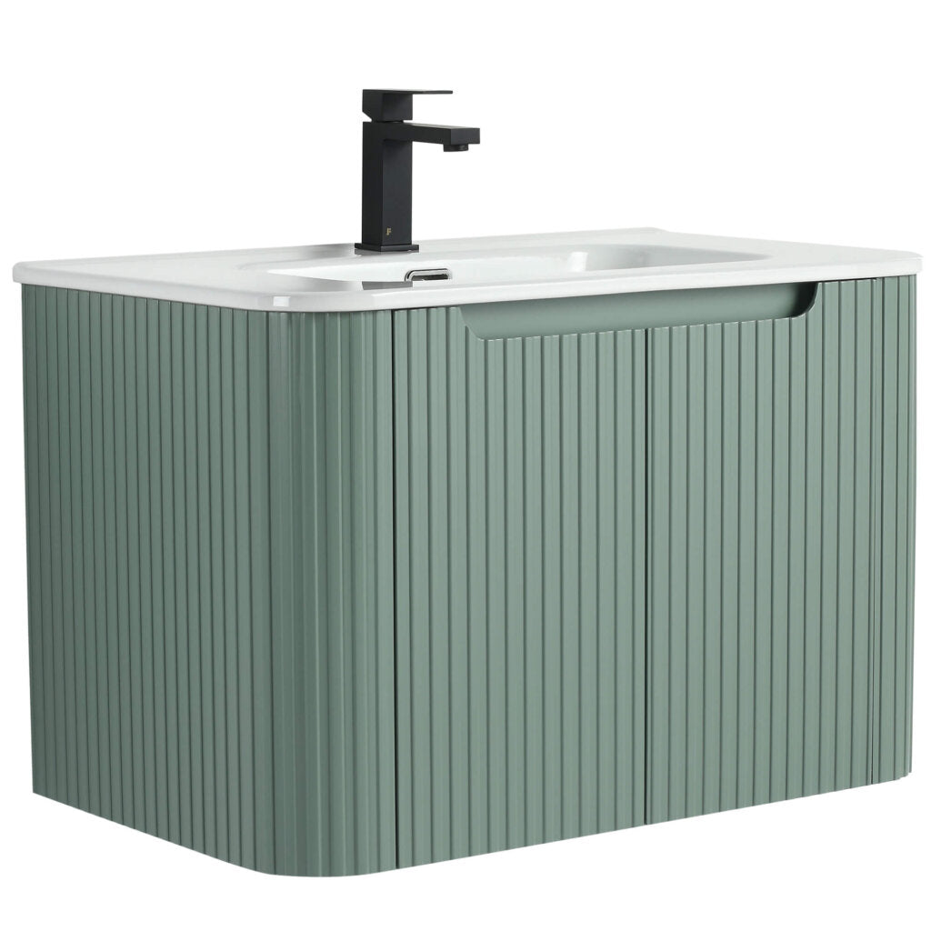 The Caskvalley 30 Inch Wall Mounted Bathroom Vanity With Sink features a ribbed green cabinet, white countertop with integrated sink, and a modern black faucet in a sleek, handle-free design for an elegant bathroom upgrade.