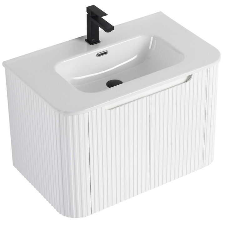 The Caskvalley 30 Wall Mounted Bathroom Vanity features a modern white rectangular design with ribbed textures, a sleek black faucet, and integrated overflow. Its concealed drain adds to the minimalist contemporary style.