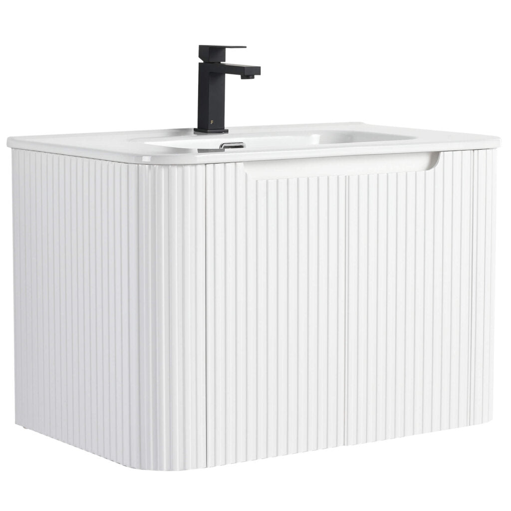 The Caskvalley 30 Inch Wall Mounted Bathroom Vanity With Sink boasts a white vanity with vertical grooves, a smooth countertop, an integrated sink, and a sleek black faucet for a minimalist and contemporary vibe.