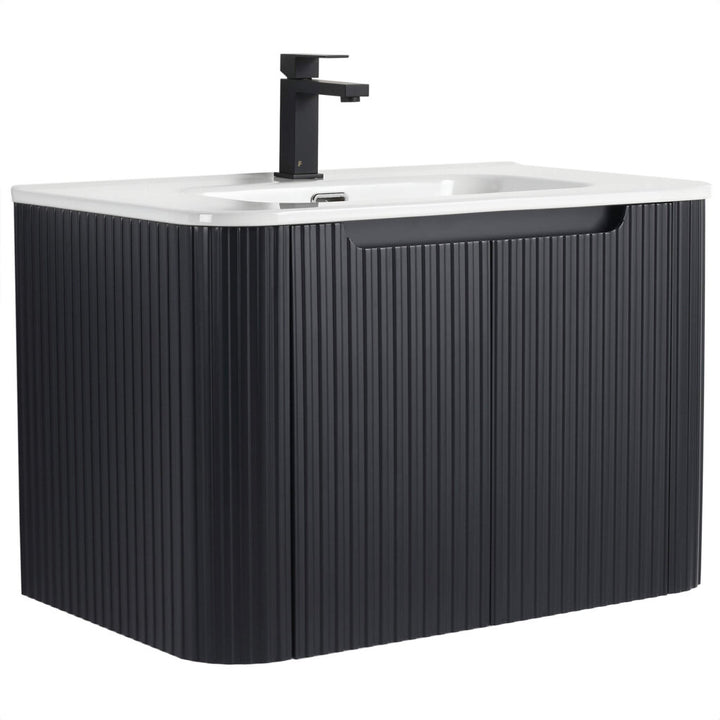 The Caskvalley 30 Wall Mounted Bathroom Vanity adds a modern touch with its sleek black ribbed cabinet, white countertop, minimalist black faucet add-on, and convenient handle for easy storage access—ideal for elevating your space.