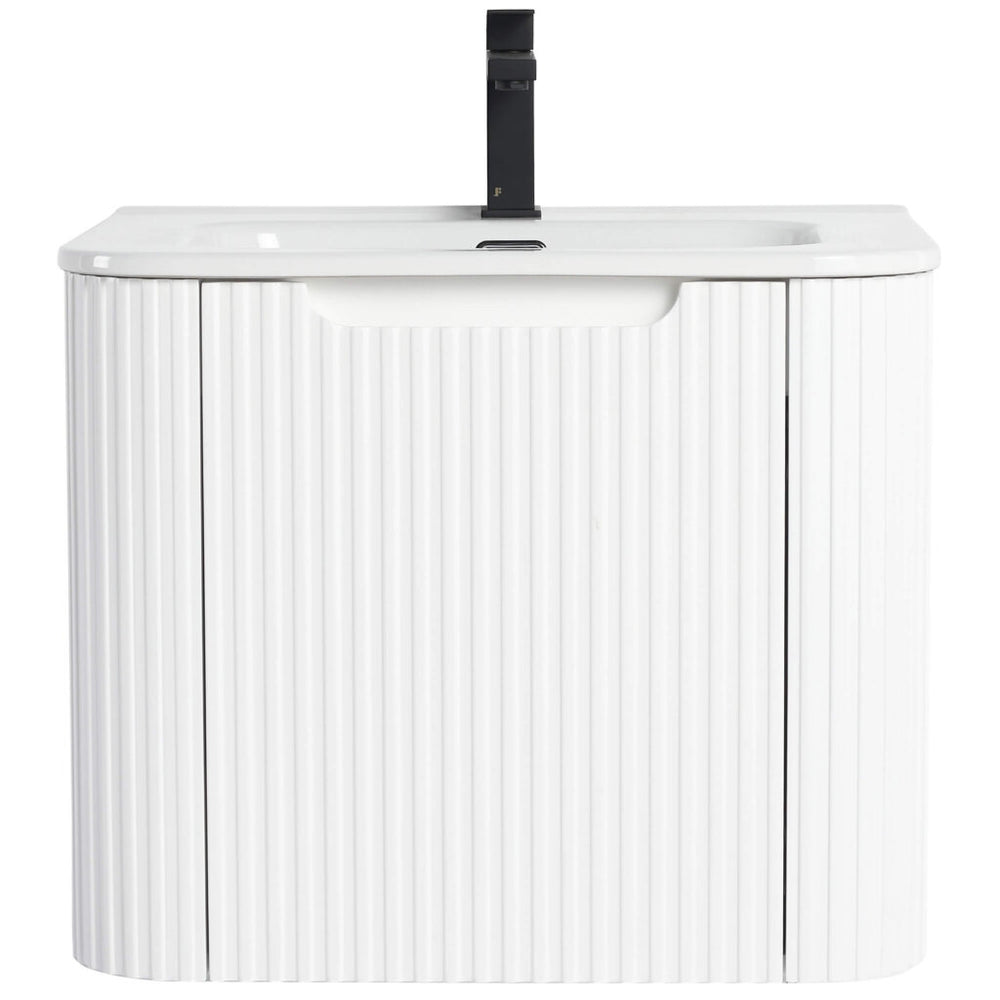 The Caskvalley 24 Inch Wall Mounted Bathroom Vanity With Sink boasts a minimalist design with a white ribbed texture. It includes a rectangular basin, integrated black faucet, and two storage doors below for a modern, sleek bathroom look.