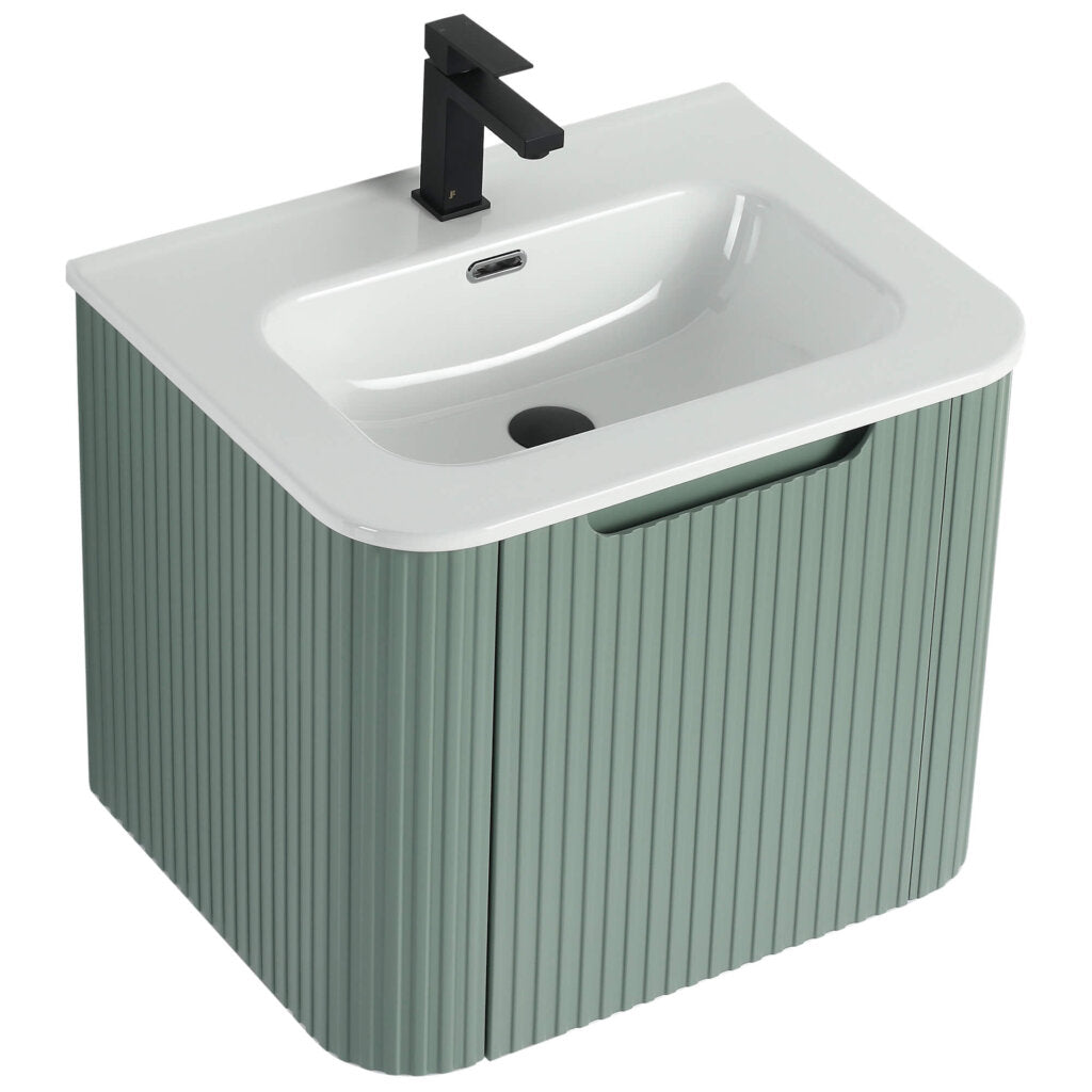 The Caskvalley 24 Inch Wall Mounted Bathroom Vanity With Sink boasts a modern design with a sleek white basin, matte black faucet, and a muted green pedestal featuring vertical grooves for a contemporary touch.