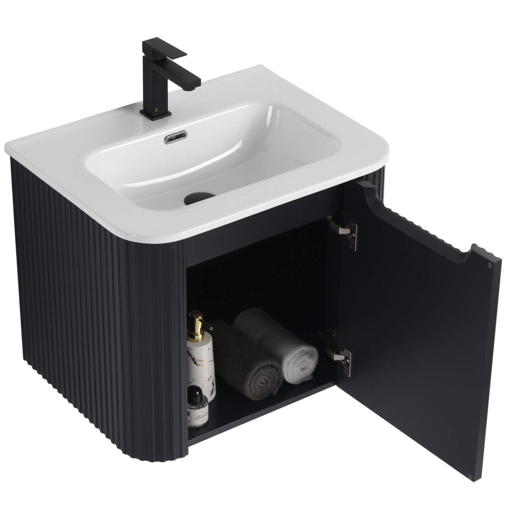 The Caskvalley 24 Inch Wall Mounted Bathroom Vanity With Sink flaunts a sleek black look, featuring a countertop sink and faucet. Inside the open cabinet door, youll find two rolled towels and bottles, while ribbed-textured sides add a touch of elegance.