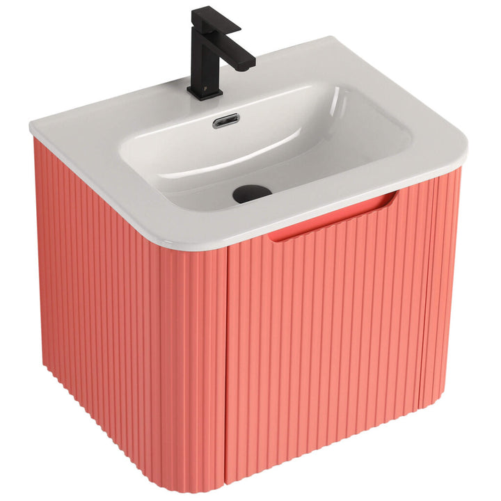 The Caskvalley 24-Inch Vanity features a modern sink, white basin, coral ribbed cabinet, and minimalist black faucet, blending function and style.