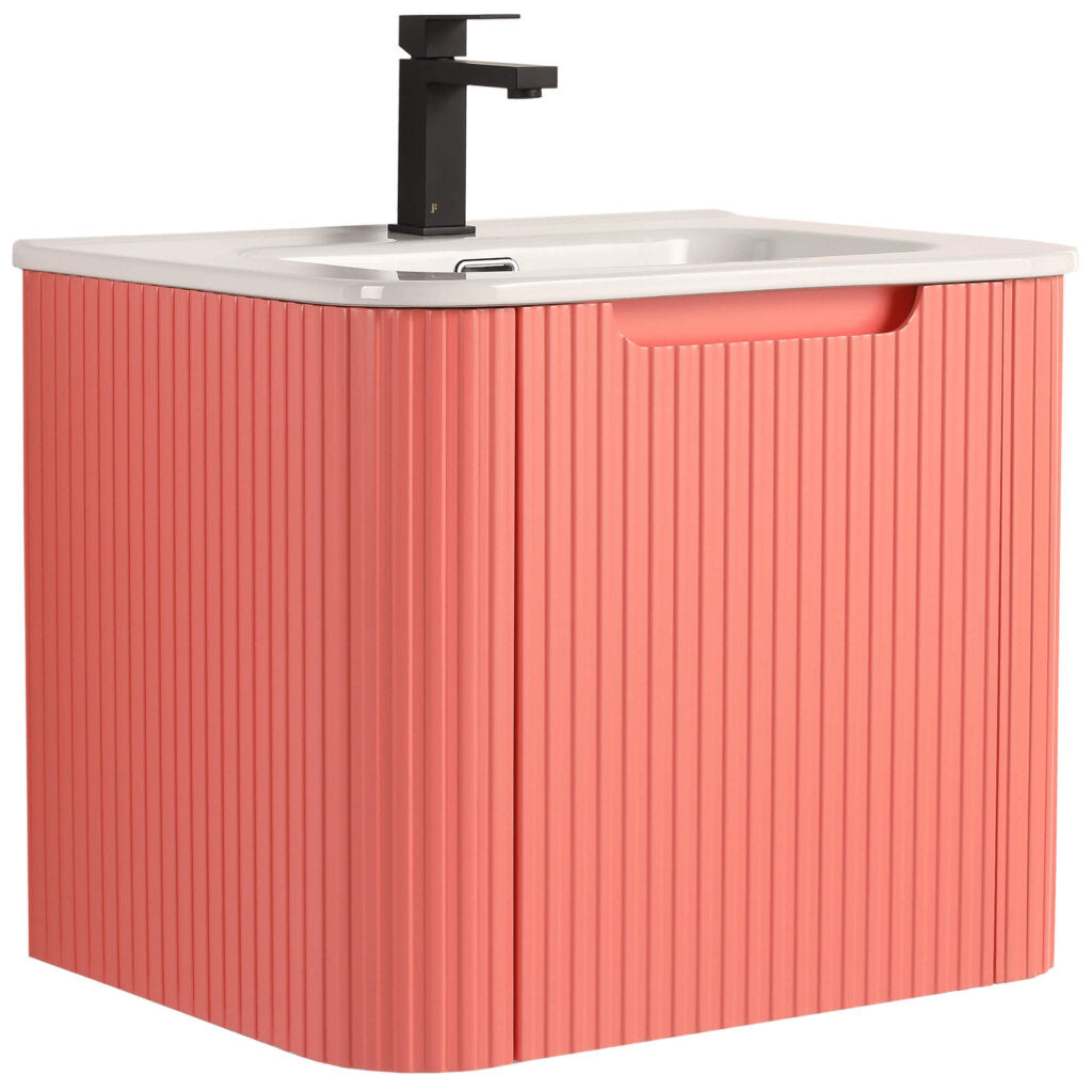 The Caskvalley 24 Wall Mounted Bathroom Vanity With Sink features a modern design with a ribbed pink cabinet, white countertop, sleek black rectangular faucet, and integrated handle for stylish yet functional bathroom elegance.