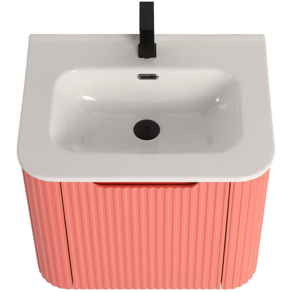 The Caskvalley 24 Inch Wall Mounted Bathroom Vanity With Sink includes a white ceramic basin, black faucet, and an overflow drain. Its sleek rectangular design is enhanced by a bright coral corrugated exterior for a minimalist touch.