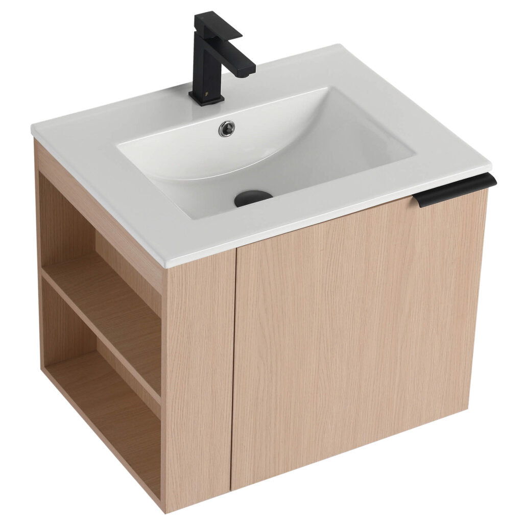 The Elmridge 24 Inch Wall Mounted Bathroom Vanity with Sink boasts left-side open shelves, a sleek white rectangular sink, and a modern black faucet. Its light wood finish is perfect for minimalist designs.