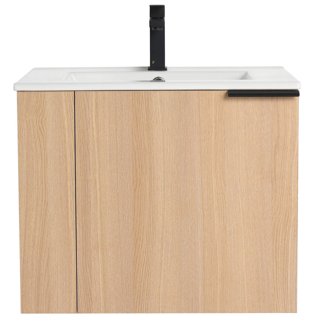 The Elmridge 24 Wall Mounted Bathroom Vanity has a light wood finish, a rectangular white basin, and a modern black faucet. Its single door with a right-side black handle adds style and functionality.