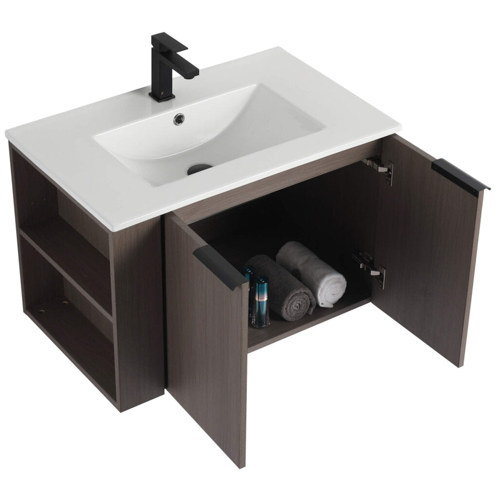 The Elmridge 30 Inch Wall Mounted Bathroom Vanity With Sink features a wooden finish, white rectangular sink, black faucet, open cabinets for towels and toiletries, and left-side shelves for extra storage. Its partially open doors add casual charm.