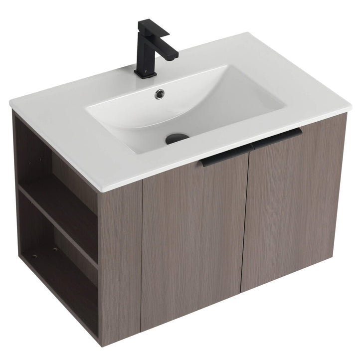 The Elmridge 30 Inch Wall Mounted Bathroom Vanity With Sink combines modern design with a white sink and black faucet, featuring a wood finish, two doors, and side open shelving for storage. It offers sleek minimalism paired with functional design.