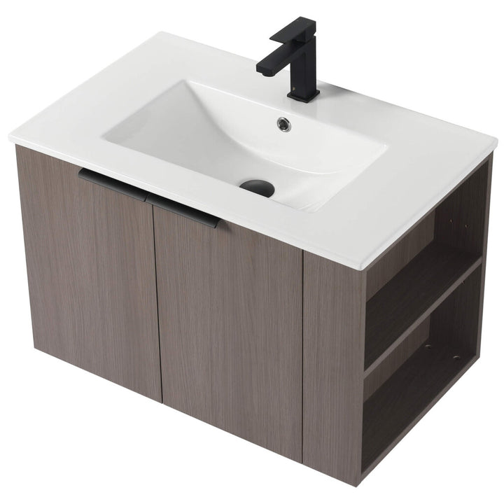 The Elmridge 30 Inch Wall Mounted Bathroom Vanity With Sink includes a stylish white rectangular sink and black faucet. Its wood-finished cabinet with black-handled doors and open side shelves provides ample storage, adding modern elegance to your bathroom.