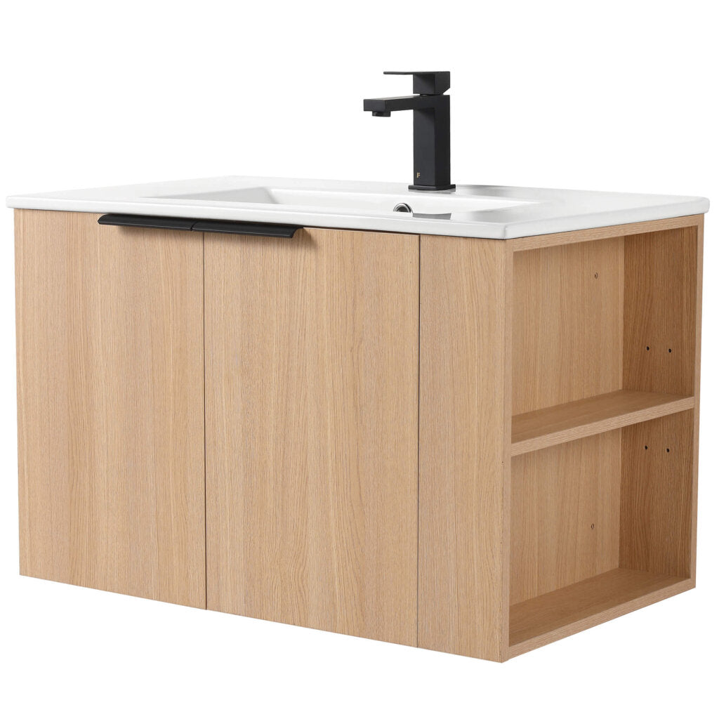 The Elmridge 30 Wall Mounted Bathroom Vanity With Sink showcases a modern, minimalist design featuring a wooden construction with a white sink and black faucet. It includes two cabinet doors with black handles and open shelves on the right for ample storage.