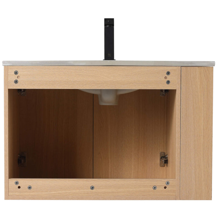 The Elmridge 30 Inch Wall Mounted Bathroom Vanity With Sink has a light wood base with open cabinet doors showing plumbing fixtures. Its countertop features a stylish faucet, and the visible hinges and screws enhance its rustic charm.