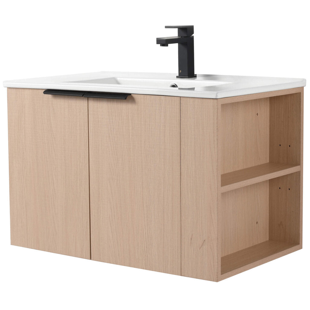 The Elmridge 30 Wall Mounted Bathroom Vanity features a modern, minimalist design with light wood, a sleek white sink, and black faucet. It includes two cabinet doors and an open shelf on the right for versatile storage.