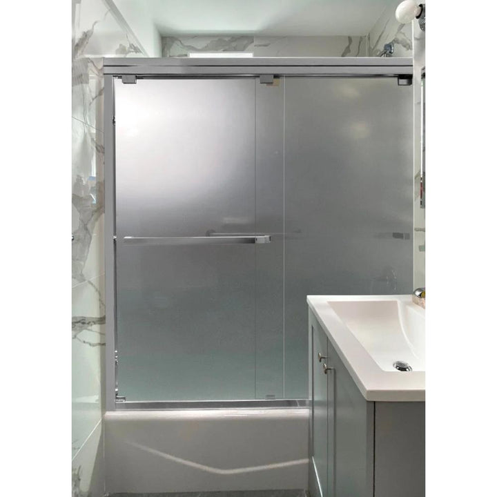 A modern bathroom featuring an ASD Cascade Shower Door – Bypass Sliding with frosted glass, a white sink on a gray vanity, and marble-patterned walls.