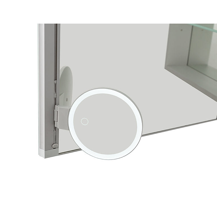 A round magnifying mirror is mounted on a large Edge Royal 60 Inch LED Lighted Mirror Medicine Cabinet, reflecting a glass shelf in the background.