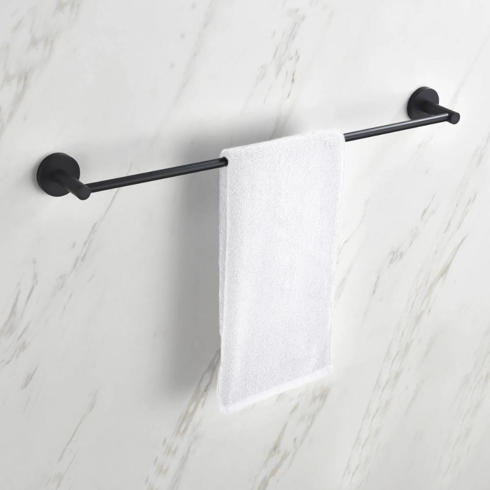 A white hand towel hangs neatly on a black Halo Bathroom Towel Bar, which is mounted on a white marble-patterned wall.