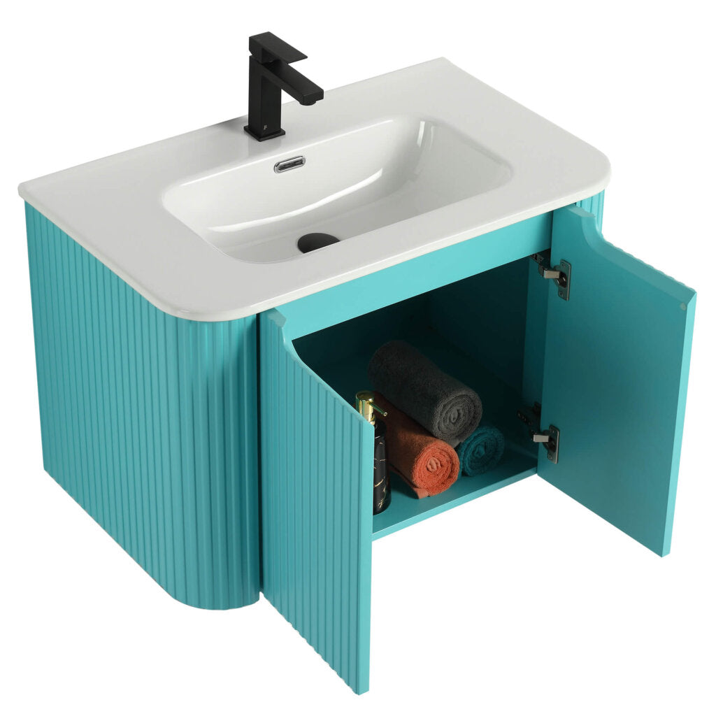 The Caskvalley 30 Inch Wall Mounted Bathroom Vanity With Sink features a turquoise finish, a sleek white sink, and a black faucet. Inside the open cabinet doors are neatly arranged rolled towels and toiletries, while ribbed texture enhances modern appeal in the lower section.