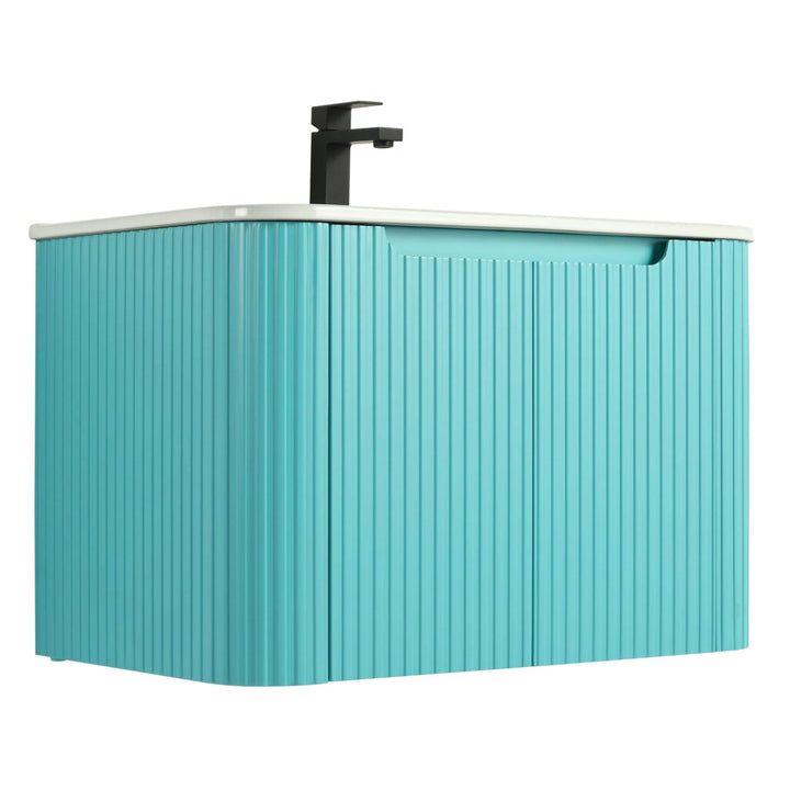 The Caskvalley 30 Inch Wall Mounted Bathroom Vanity has a turquoise finish with vertical ribbed design, a white rectangular countertop with integrated sink, and a sleek black faucet. Its handle-less front offers a smooth, modern aesthetic.