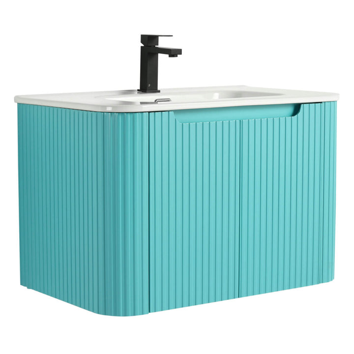 The Caskvalley 30 Wall Mounted Bathroom Vanity with Sink adds a modern flair to your space, showcasing a teal slatted front and white countertop. The black faucet above the white basin enriches its sleek design, complete with a cut-out handle on the drawer.