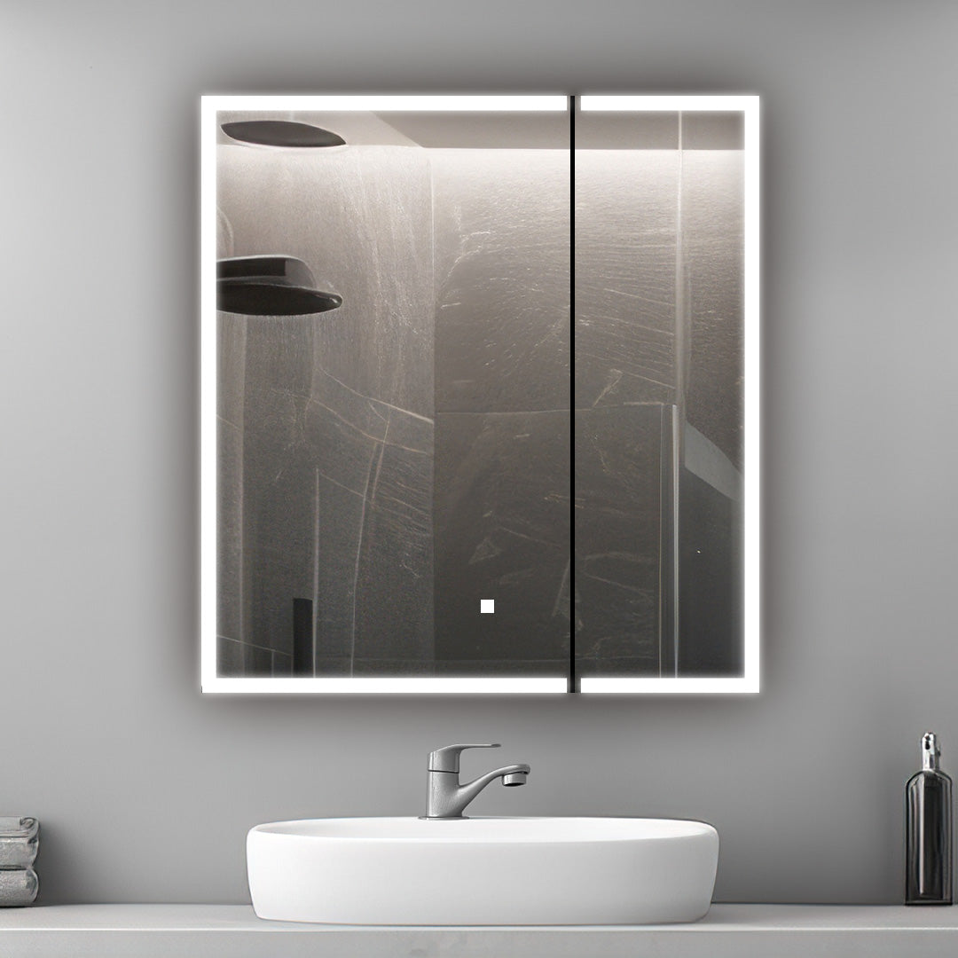 A modern bathroom features the Edge Royal 36 Inch LED Lighted Mirror Medicine Cabinet above a white sink and silver faucet. The mirror reflects a rainfall showerhead and dark-tiled shower, while a liquid soap dispenser sits on the counter.