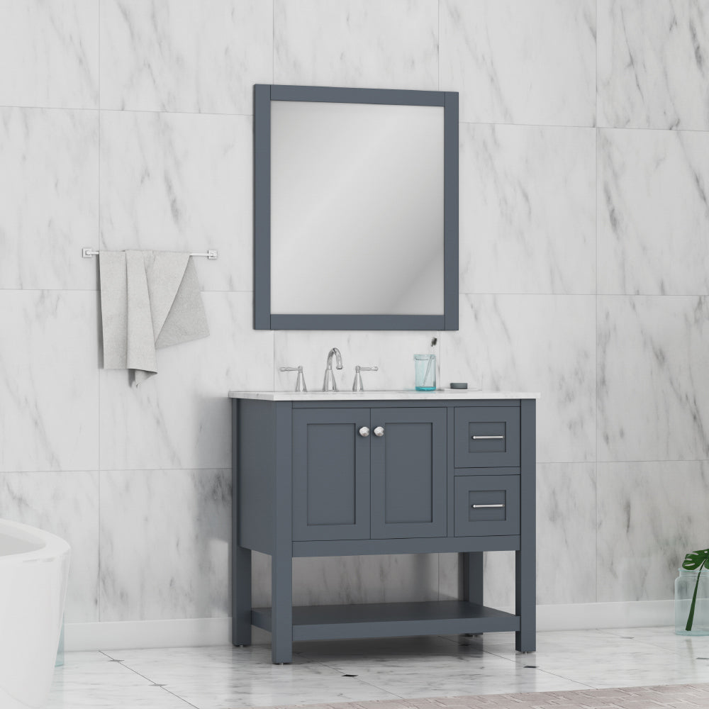 A modern bathroom showcases the Wilmington 36 Inch Bathroom Vanity Cabinet in Gray (no top), paired with a white countertop, silver faucet, matching mirror, gray towels on a rack, and white marble wall tiles.