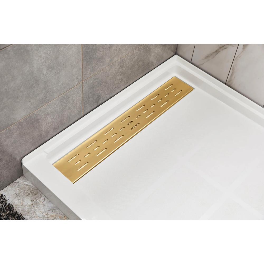 A modern shower floor featuring the Bhavana Single Threshold Shower Base with a rectangular white tray and gold linear drain cover, set against sleek gray and marble-patterned wall tiles.
