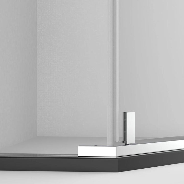 A close-up view of the Maggie Neo Angle Hinged Shower Door featuring a metal hinge and black shower base, set against light-colored walls.