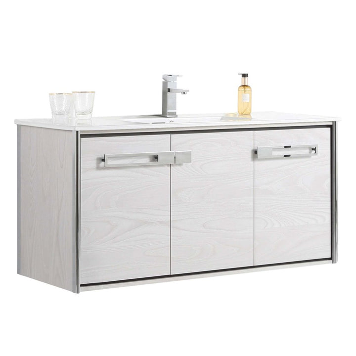 The Oakville 48 inch Modern Bathroom Vanity features a modern white design with a sink, chrome faucet, soap dispenser, two glasses, and three cabinet doors with sleek metal handles.