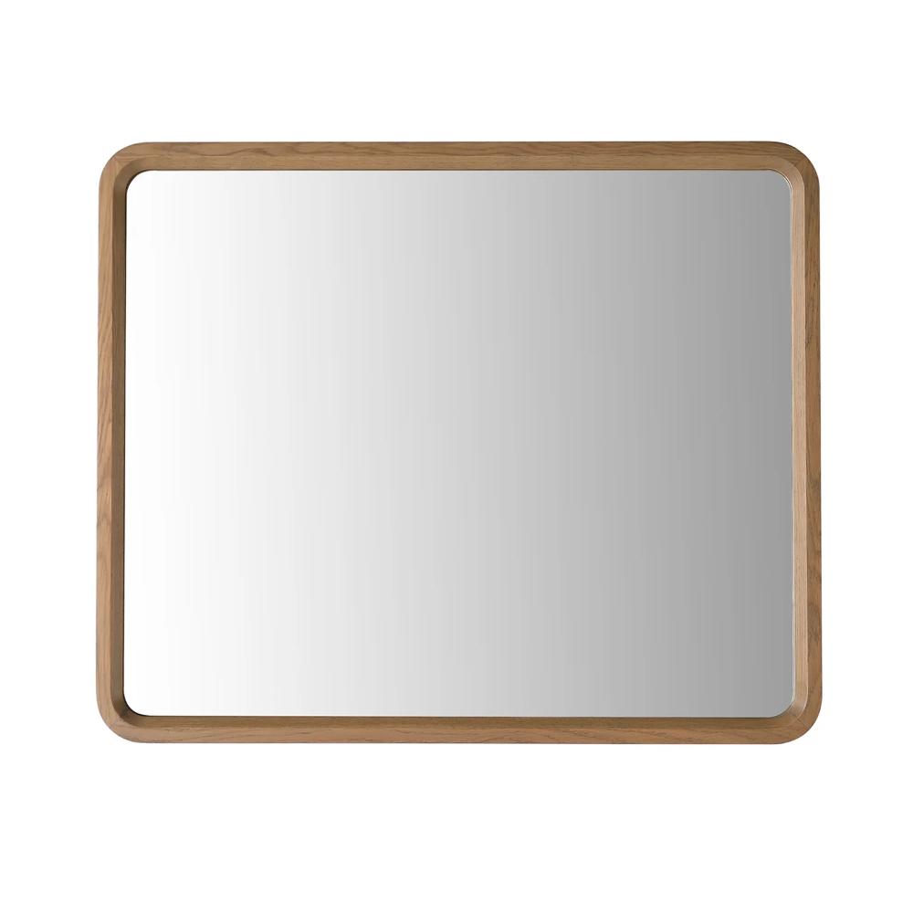 The Vela Mirrors feature a rectangular design with rounded corners and a light wood frame, displayed against a plain white background.