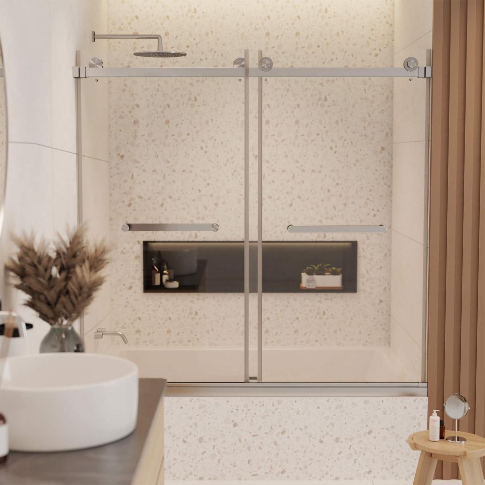 Modern bathroom with a Tub Door Double Sliding Frameless, terrazzo tile walls, built-in bathtub, black recessed shelf for toiletries, and a countertop featuring a round sink and a vase of dried flowers.
