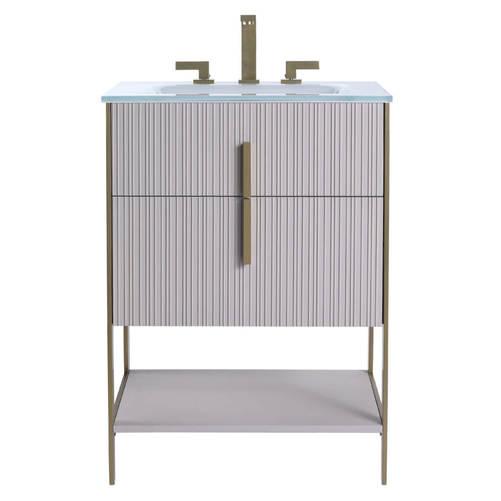 The Serenity 24 Inch Bathroom Vanity boasts a ribbed light gray cabinet, gold hardware and faucet, white integrated sink, slim gold legs, and an open bottom shelf for a sleek, modern look.
