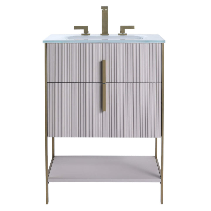 The Serenity 24 Inch Bathroom Vanity boasts a ribbed light gray cabinet, gold hardware and faucet, white integrated sink, slim gold legs, and an open bottom shelf for a sleek, modern look.