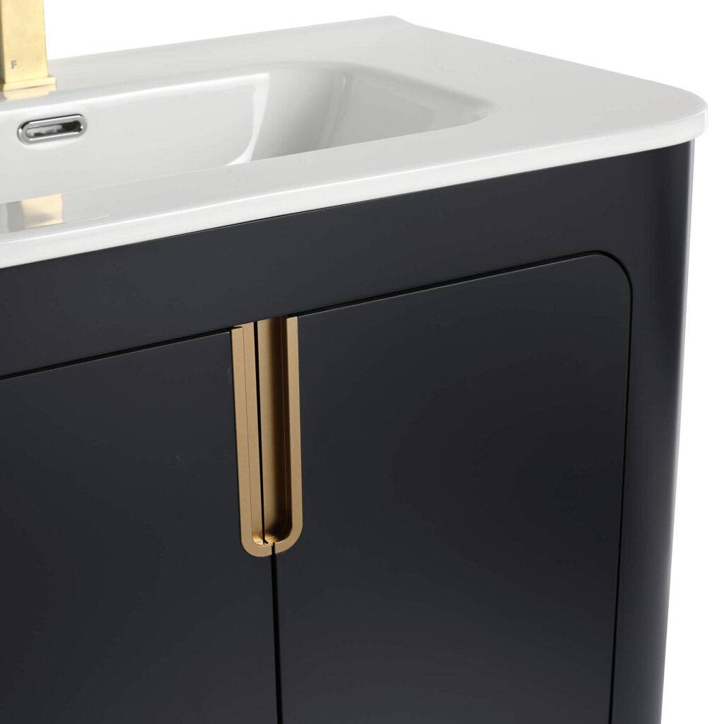 The Shireplace 30 Inch Bathroom Vanity features a white sink on a dark, curved cabinet with a gold vertical handle for elegance and a partially visible shiny faucet above.