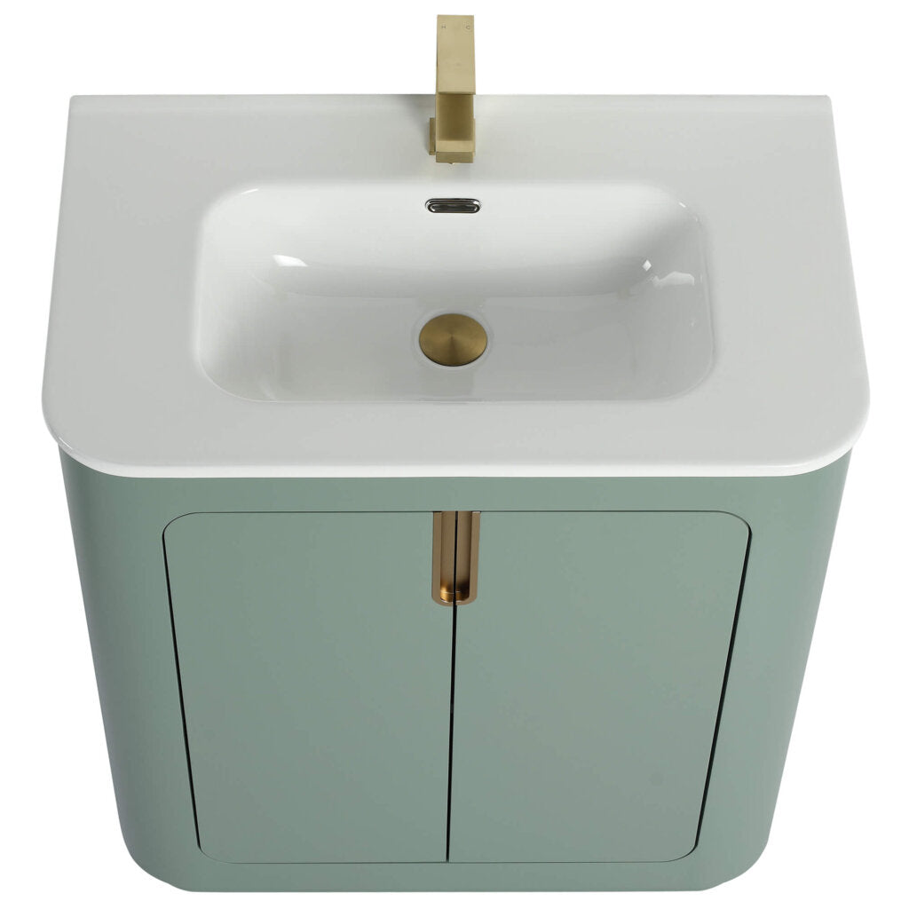 The Shireplace 30 Inch Bathroom Vanity features a modern rectangular white sink, gold faucet, pastel green cabinet, and two doors with a central gold handle, perfect for a contemporary bathroom.