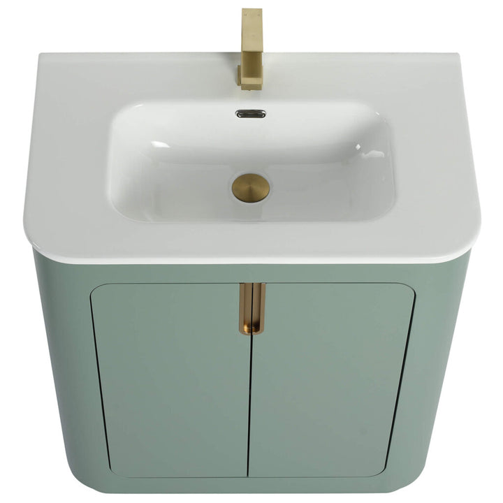The Shireplace 30 Inch Bathroom Vanity features a modern rectangular white sink, gold faucet, pastel green cabinet, and two doors with a central gold handle, perfect for a contemporary bathroom.