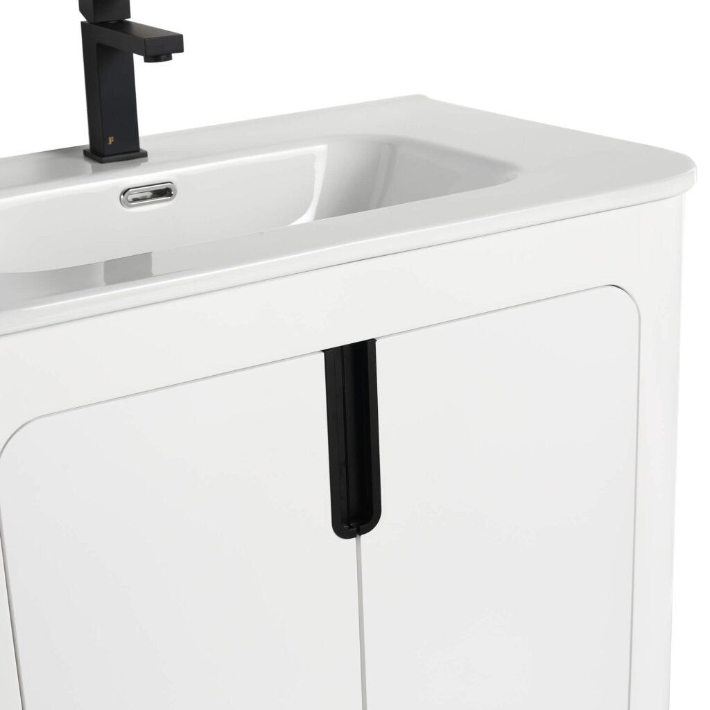 The Shireplace 30 Inch Bathroom Vanity With Sink showcases a modern look with a rectangular sink, sleek black faucet, glossy white cabinet doors, and vertical black stripes for a minimalist aesthetic.