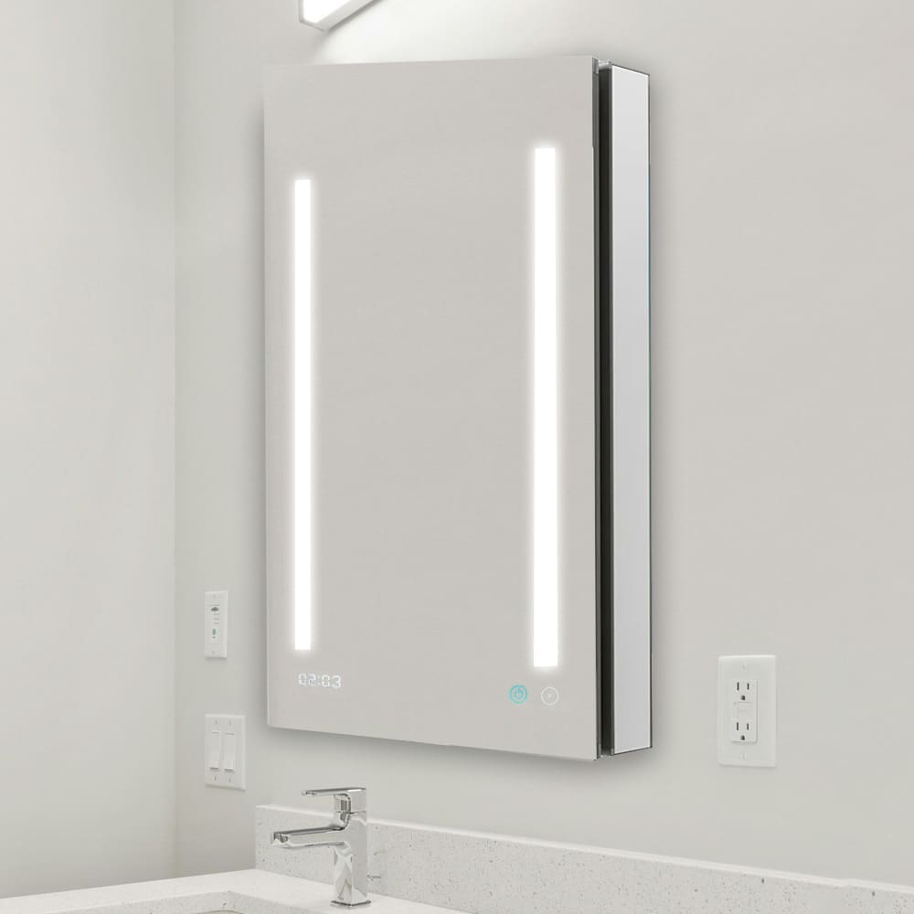 The Signature Royale 24"x36" Right Sided LED Lighted Mirror Medicine Cabinet features two vertical LED strips, a digital clock, and touch controls, perfect for mounting above a white countertop with sink and faucet.