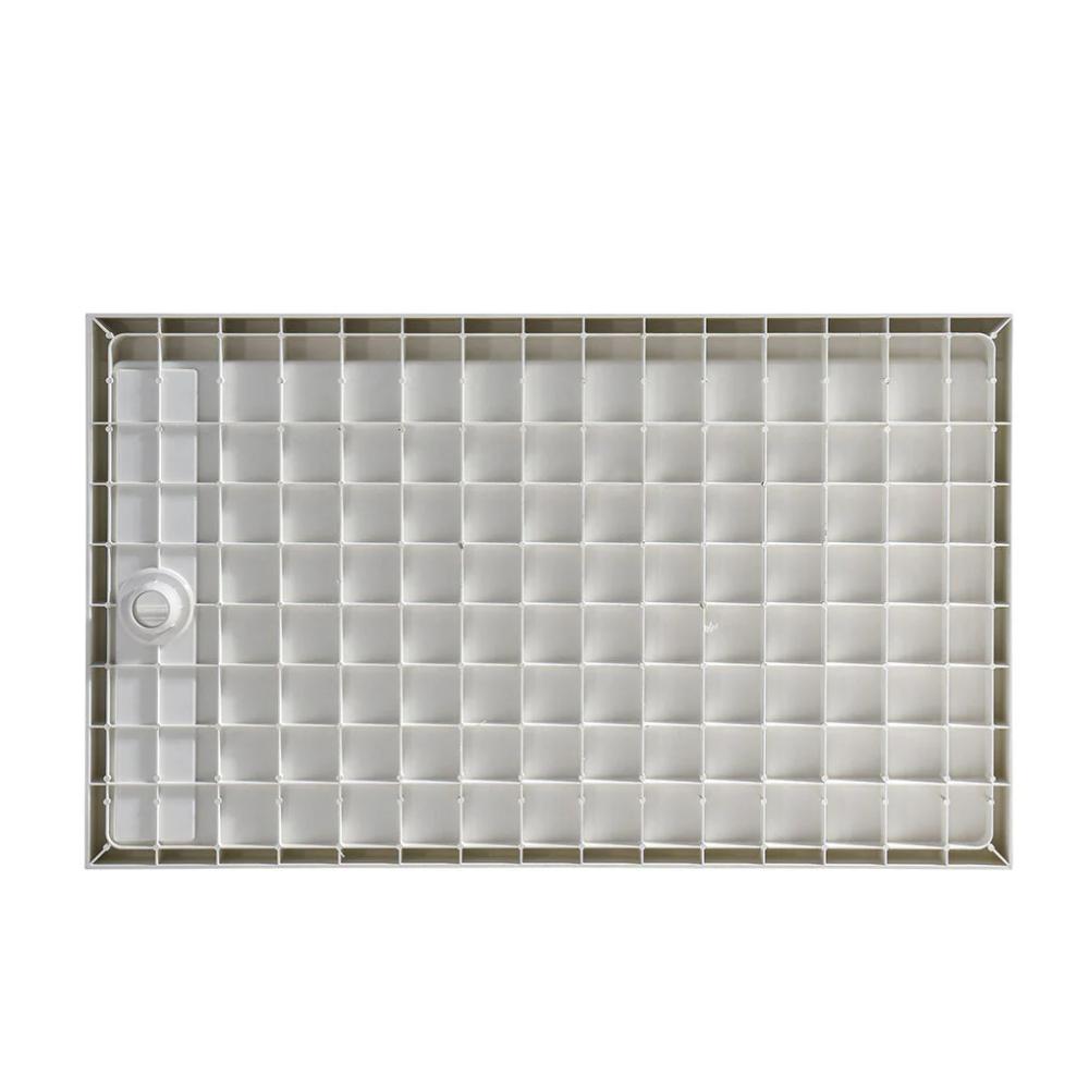 A light gray Bhavana Single Threshold Shower Base, rectangular with a grid of square compartments and a round drainage hole on the left side, is shown from above.