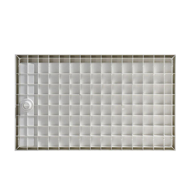 A light gray Bhavana Single Threshold Shower Base, rectangular with a grid of square compartments and a round drainage hole on the left side, is shown from above.