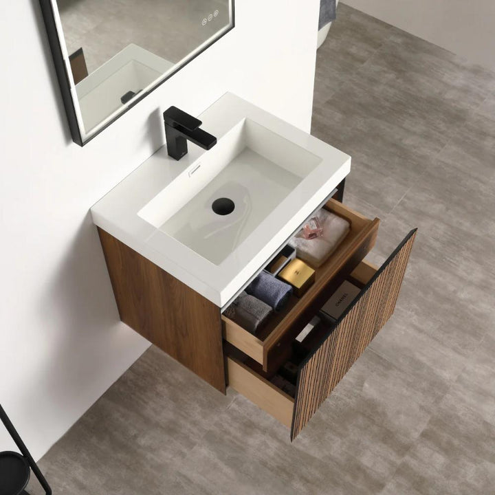 The Lille Wall Mounted Bathroom Vanity includes a white rectangular sink, a black faucet, and two open wooden drawers, perfectly organized with bathroom essentials, all highlighted by a modern gray tiled floor.